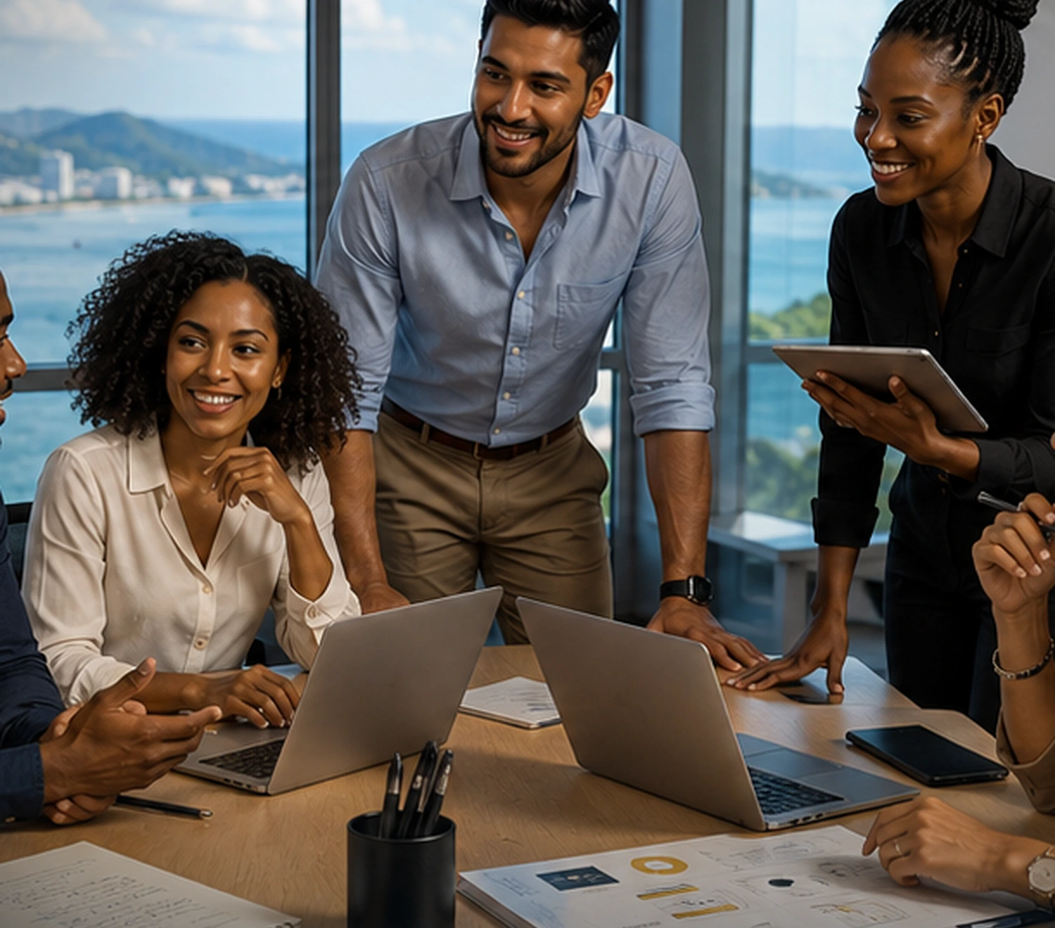 A diverse venture team collaborating in a Caribbean office